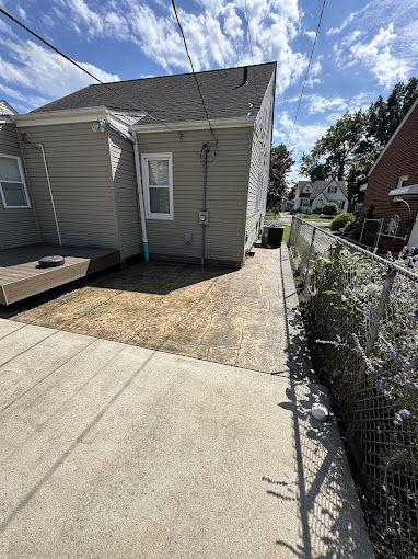 A house with a fence in front of it